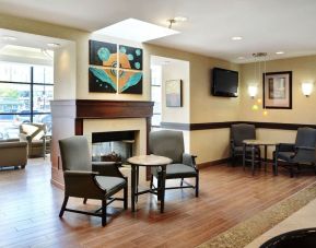 Lobby lounge with comfortable seating and fireplace at Holiday Inn Winnipeg Downtown.