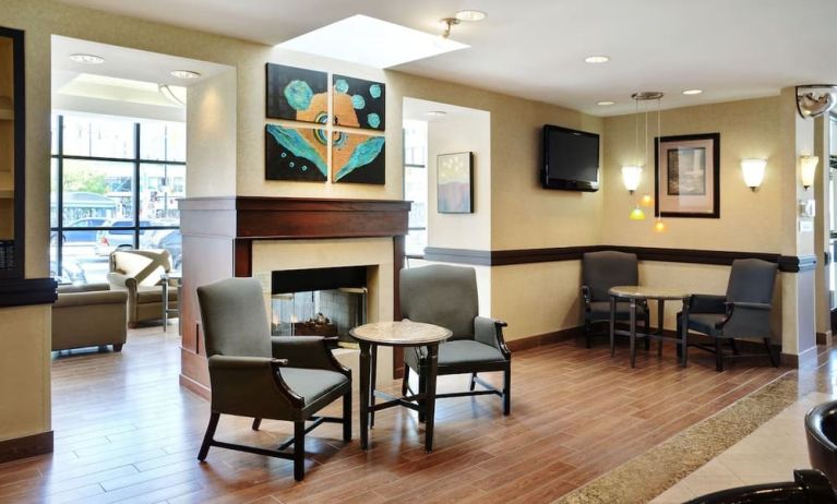 Lobby lounge with comfortable seating and fireplace at Holiday Inn Winnipeg Downtown.