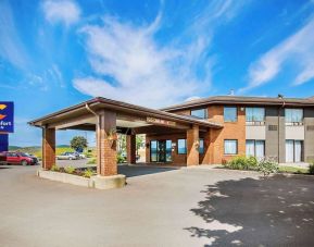 Hotel exterior and parking area at Comfort Inn Sydney.