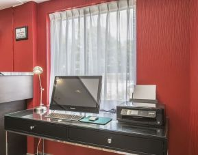 Business desk with computer and printer at Comfort Inn Sydney.