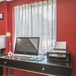 Business desk with computer and printer at Comfort Inn Sydney.