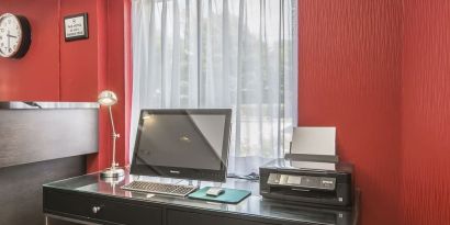 Business desk with computer and printer at Comfort Inn Sydney.