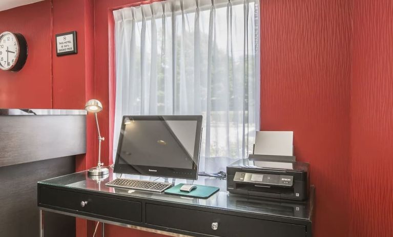 Business desk with computer and printer at Comfort Inn Sydney.