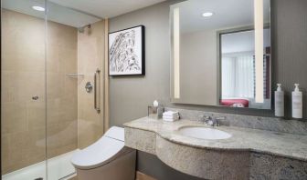 Guest bathroom with shower at Hilton Garden Inn New York/West 35th Street.