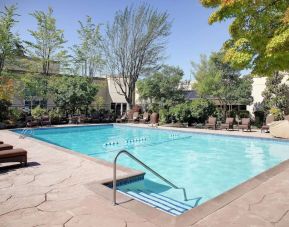 Refreshing outdoor pool at Hilton Seattle Airport & Conference Center.