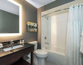 Guest bathroom with shower and tub at Comfort Inn Charlottetown.