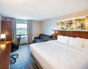 Standard day use room with TV, work desk, sofa and private bathroom at Comfort Inn Charlottetown.