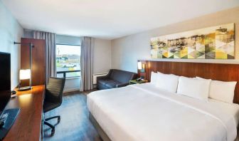 Standard day use room with TV, work desk, sofa and private bathroom at Comfort Inn Charlottetown.