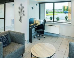 Hotel lobby workspace with computer, printer and ergonomic chair at Comfort Inn Charlottetown.