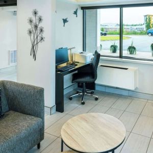 Hotel lobby workspace with computer, printer and ergonomic chair at Comfort Inn Charlottetown.