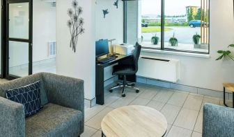 Hotel lobby workspace with computer, printer and ergonomic chair at Comfort Inn Charlottetown.