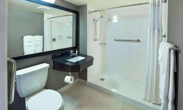 Guest bathroom with shower and free toiletries at Comfort Inn Moncton Magnetic Hill.