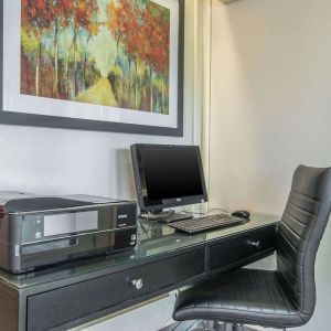 Business center with computer, printer and ergonomic chair at Comfort Inn Moncton Magnetic Hill.