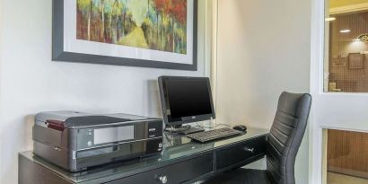 Business center with computer, printer and ergonomic chair at Comfort Inn Moncton Magnetic Hill.