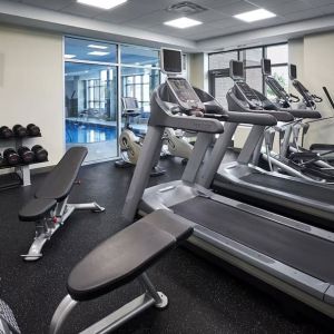 Fully equipped fitness center at Holiday Inn & Suites Oakville At Bronte.