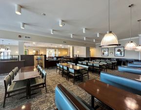 Dining area with comfortable seating at Holiday Inn Toronto Airport East.