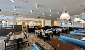 Dining area with comfortable seating at Holiday Inn Toronto Airport East.