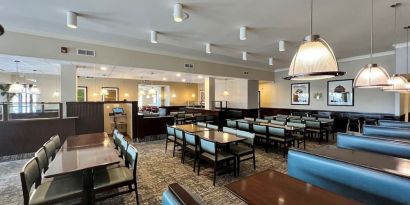 Dining area with comfortable seating at Holiday Inn Toronto Airport East.