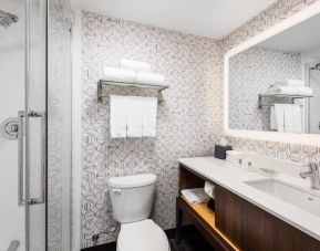 Guest bathroom with shower and free toiletries at Holiday Inn Toronto Airport East.