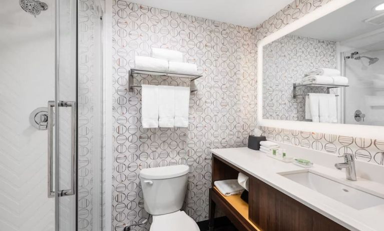 Guest bathroom with shower and free toiletries at Holiday Inn Toronto Airport East.