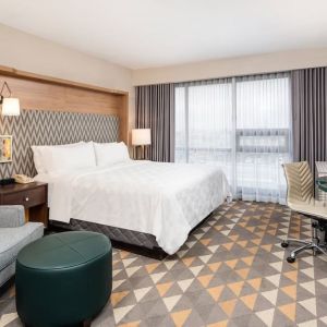 Day use room with work desk and sofa at Holiday Inn Toronto Airport East.