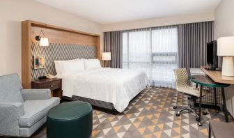 Day use room with work desk and sofa at Holiday Inn Toronto Airport East.