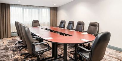 Professional meeting room with ergonomic chairs at Holiday Inn Toronto Airport East.