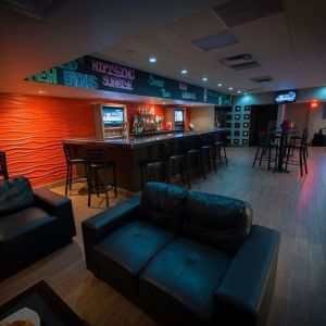 Hotel bar with lounge area at Best Western North Bay. 