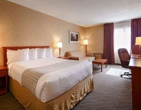 Day use room with work desk, living area and private bathroom at Best Western North Bay.