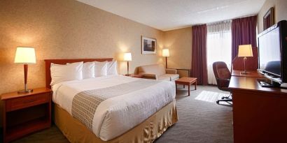 Day use room with work desk, living area and private bathroom at Best Western North Bay.