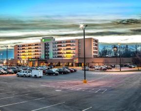 Hotel exterior and parking area at Holiday Inn Laval Montreal.