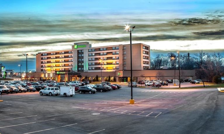 Hotel exterior and parking area at Holiday Inn Laval Montreal.