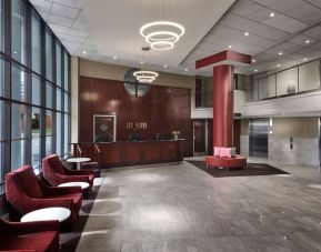 Lobby lounge with comfortable seating at Les Suites Hotel Ottawa.