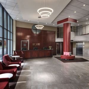 Lobby lounge with comfortable seating at Les Suites Hotel Ottawa.