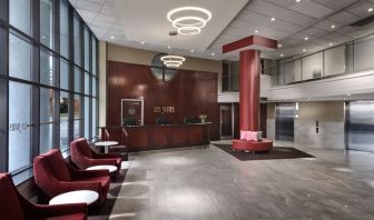 Lobby lounge with comfortable seating at Les Suites Hotel Ottawa.