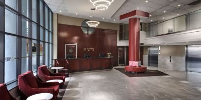 Lobby lounge with comfortable seating at Les Suites Hotel Ottawa.