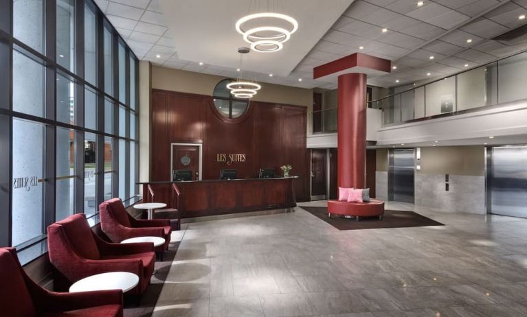 Lobby lounge with comfortable seating at Les Suites Hotel Ottawa.