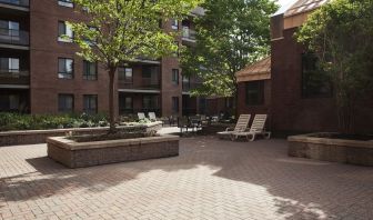 Outdoor patio with lounge seating at Les Suites Hotel Ottawa.