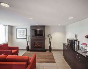 Lobby lounge with comfortable seating and fireplace at Comfort Inn Edmonton West.