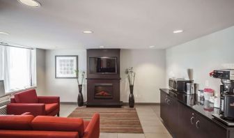 Lobby lounge with comfortable seating and fireplace at Comfort Inn Edmonton West.