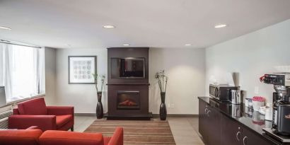 Lobby lounge with comfortable seating and fireplace at Comfort Inn Edmonton West.