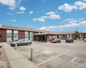 Hotel exterior and parking area at Comfort Inn Edmonton West.