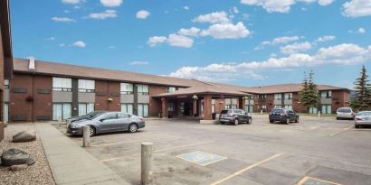 Hotel exterior and parking area at Comfort Inn Edmonton West.