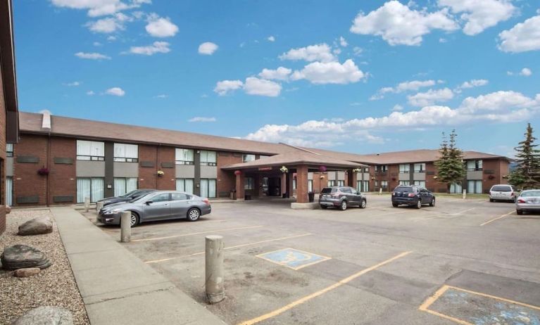 Hotel exterior and parking area at Comfort Inn Edmonton West.