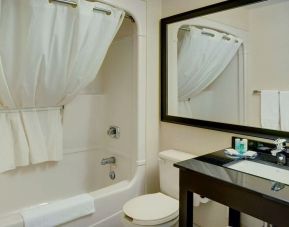 Guest bathroom with tub and free toiletries at Comfort Inn Edmonton West.