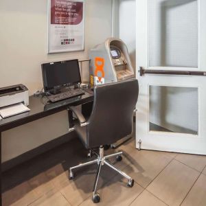 Business center with computer, printer, ergonomic chair and ATM at Comfort Inn Edmonton West.