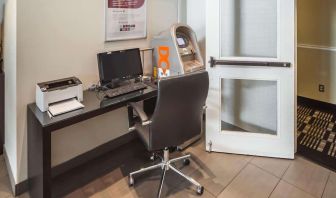 Business center with computer, printer, ergonomic chair and ATM at Comfort Inn Edmonton West.