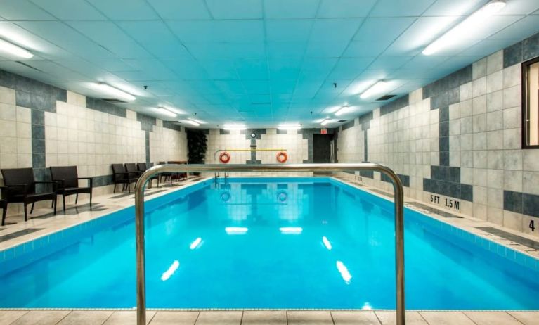 Indoor heated pool with lounge chairs at Halifax Airport Hotel.