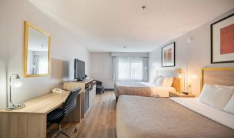 Bright and spacious day use twin room with work desk at Halifax Airport Hotel.