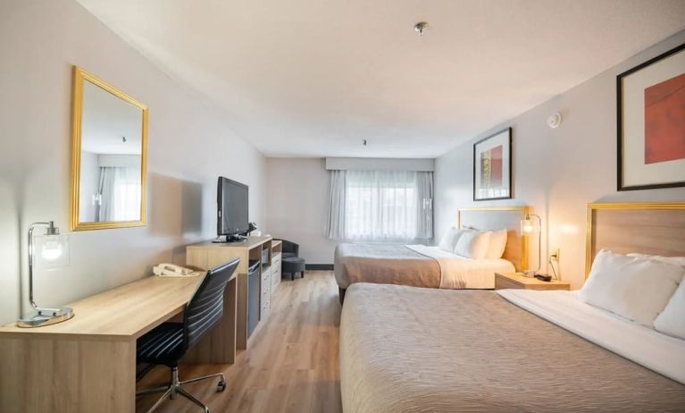 Bright and spacious day use twin room with work desk at Halifax Airport Hotel.